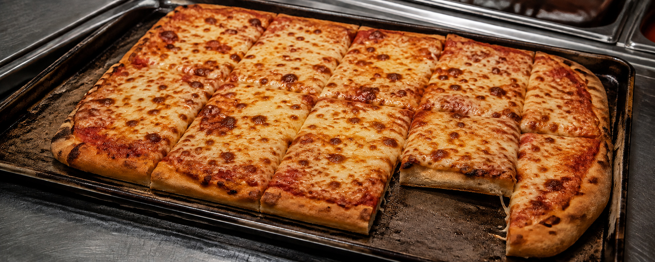 Golden square-cut cheese pizza